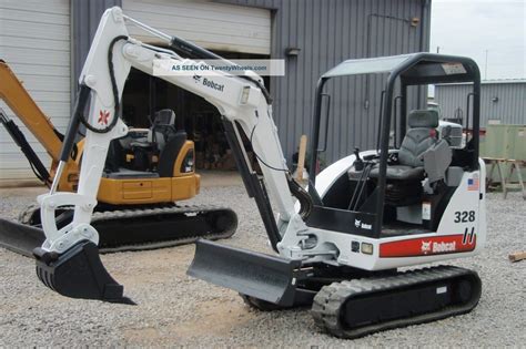 compact mini excavator|smallest bobcat mini excavator.